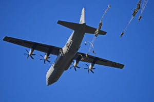 A C-130 Super Hercules transport aircraft in the sky