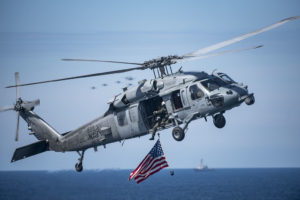 A MH-60R/S Seahawk helicopter in the sky